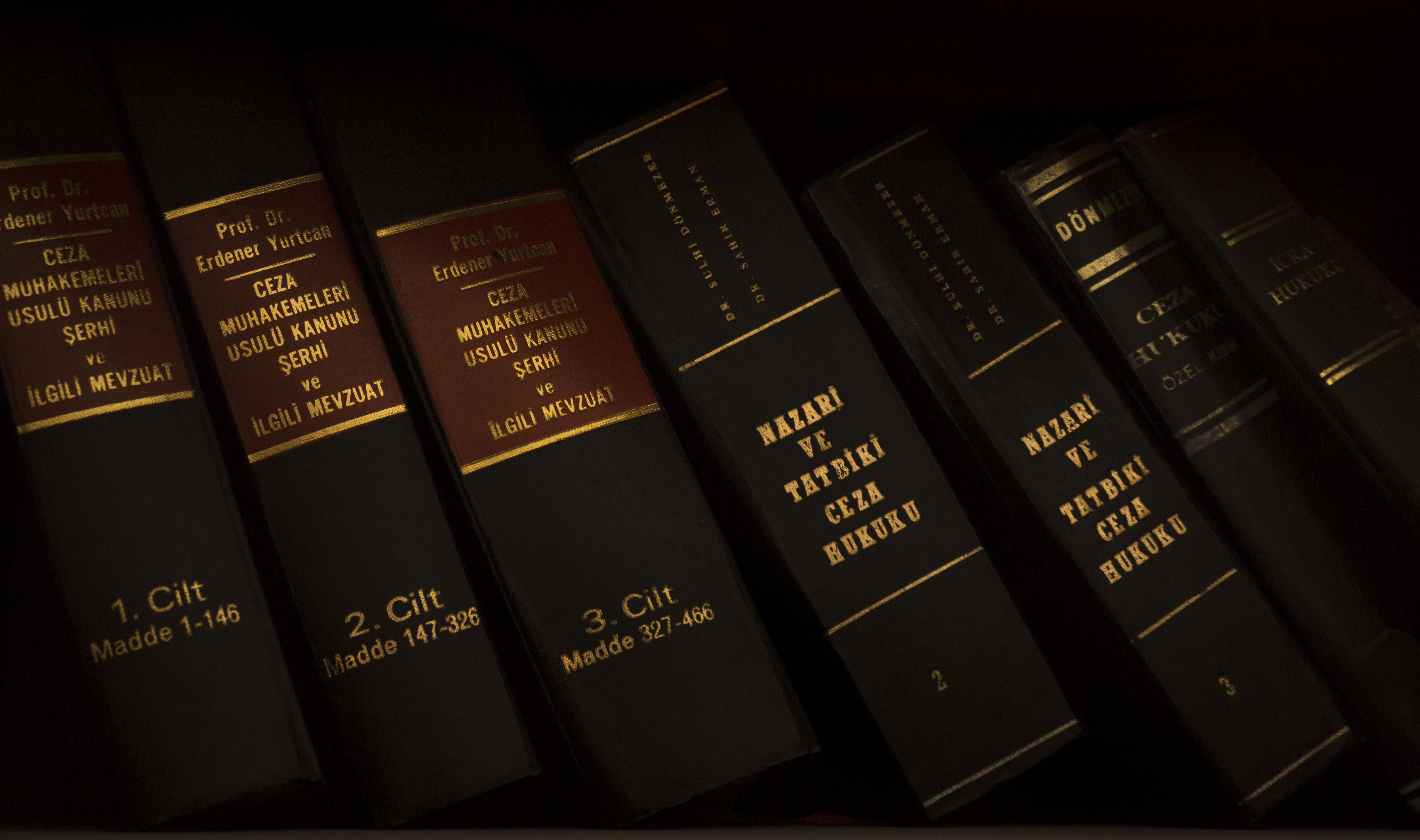Stack of law books in a library used for legal research and appeals in major court cases