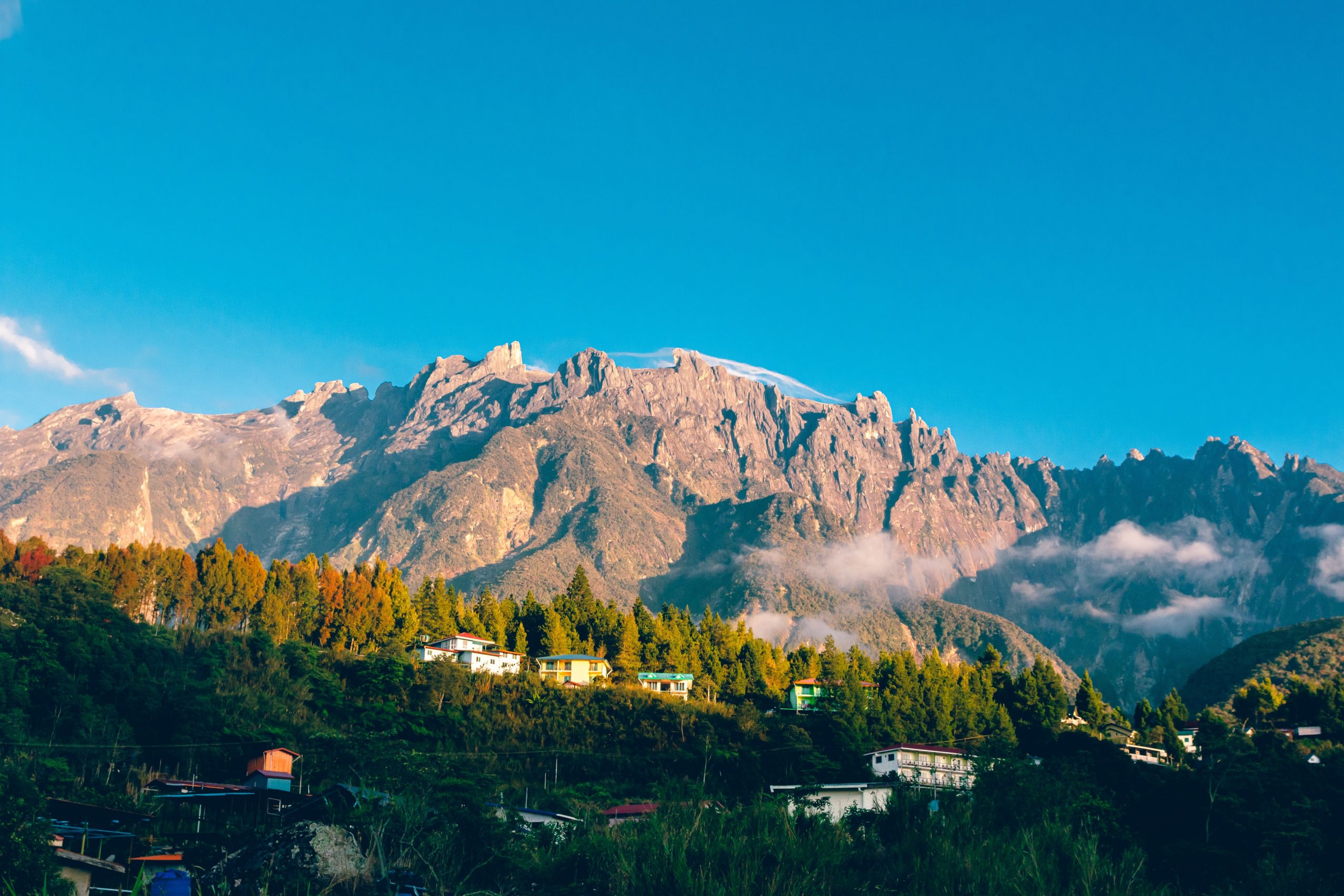 Aerial view of Mount Kinabalu and a village in Sabah, Malaysia